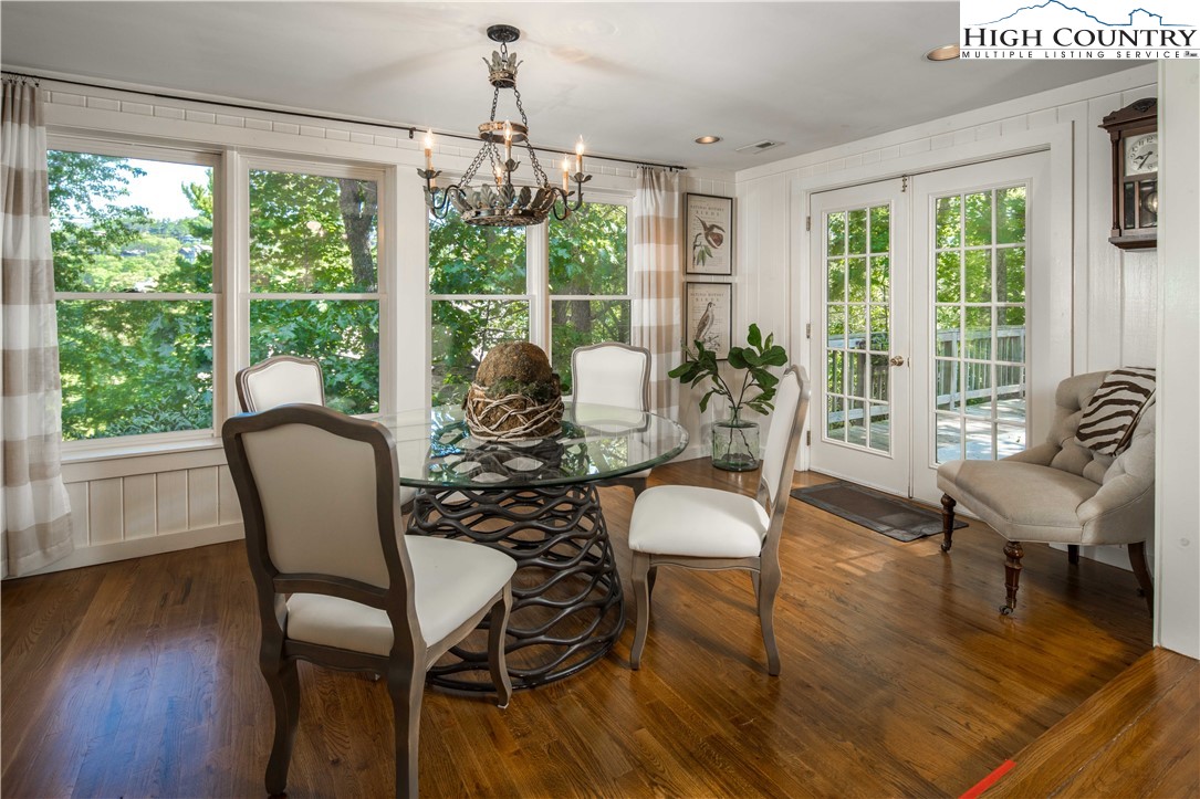 271 Pinnacle Avenue Blowing Rock, NC 28605 - Photo 14 of 43 a dining room with furniture a chandelier and wooden floor