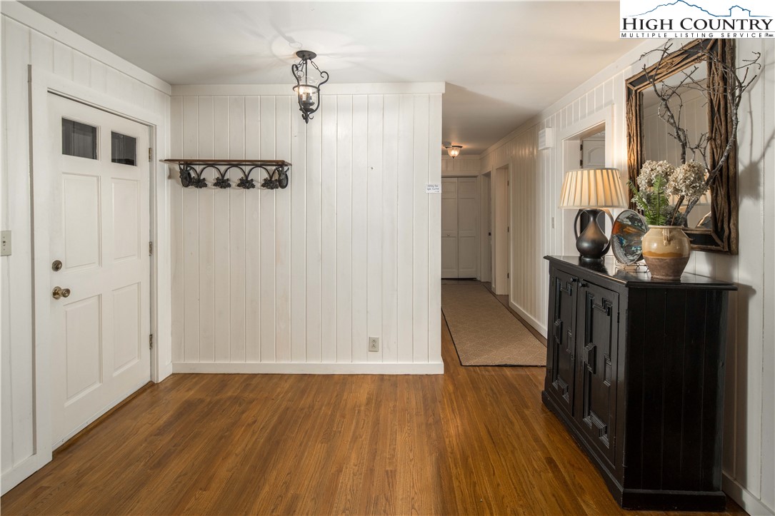 271 Pinnacle Avenue Blowing Rock, NC 28605 - Photo 17 of 43 a view of a hallway with wooden floor and staircase