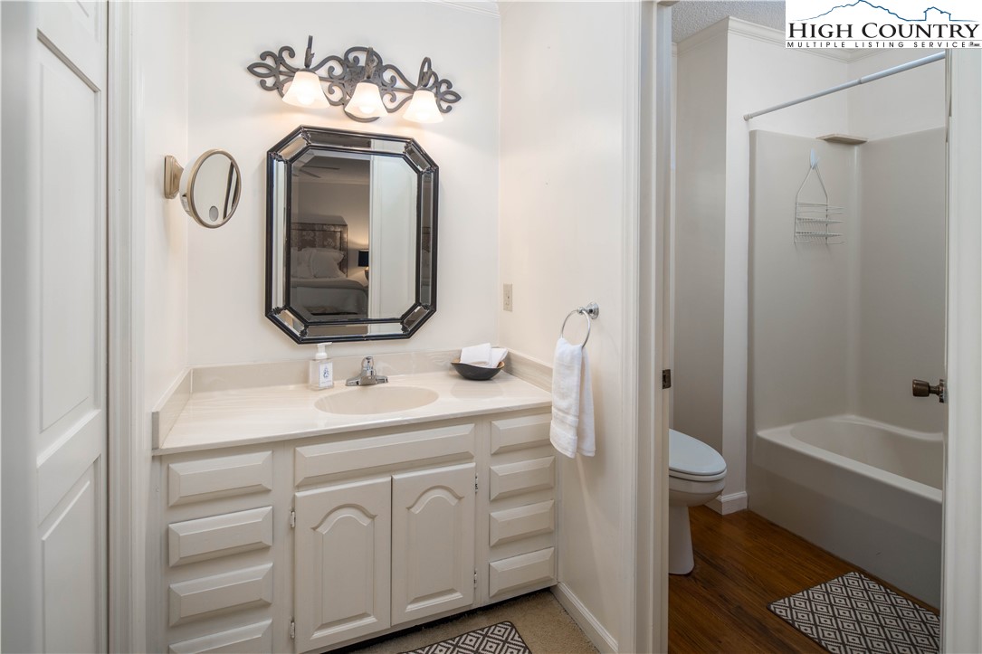 271 Pinnacle Avenue Blowing Rock, NC 28605 - Photo 23 of 43 a bathroom with a sink a toilet and shower