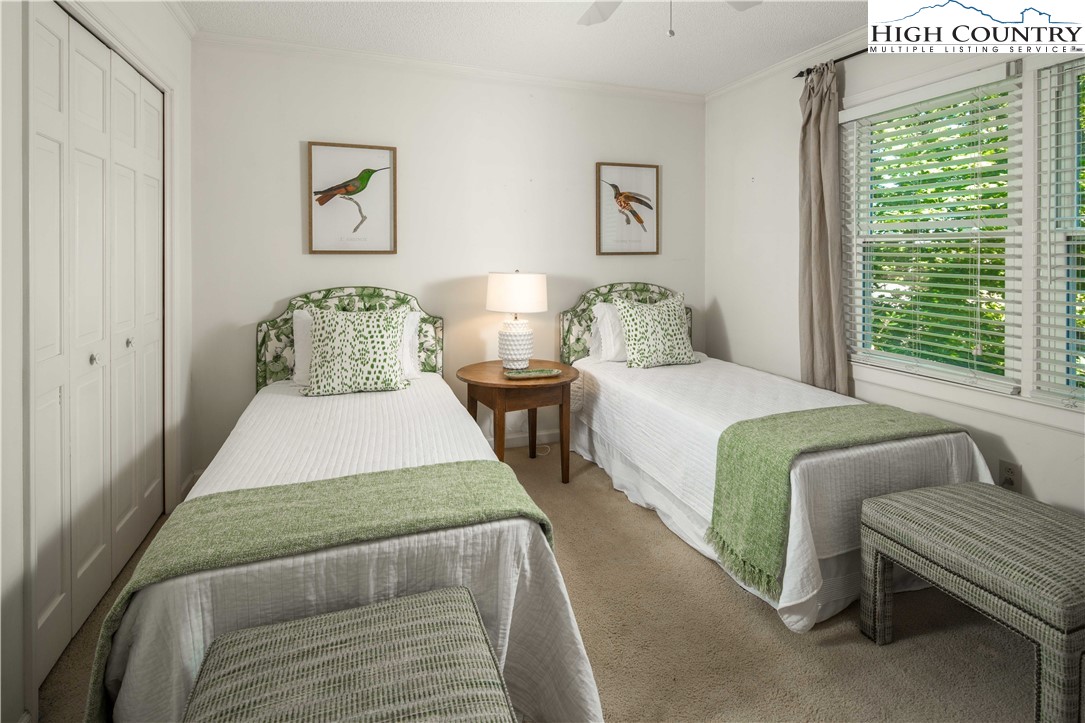 271 Pinnacle Avenue Blowing Rock, NC 28605 - Photo 25 of 43 a bedroom with a bed and glass window