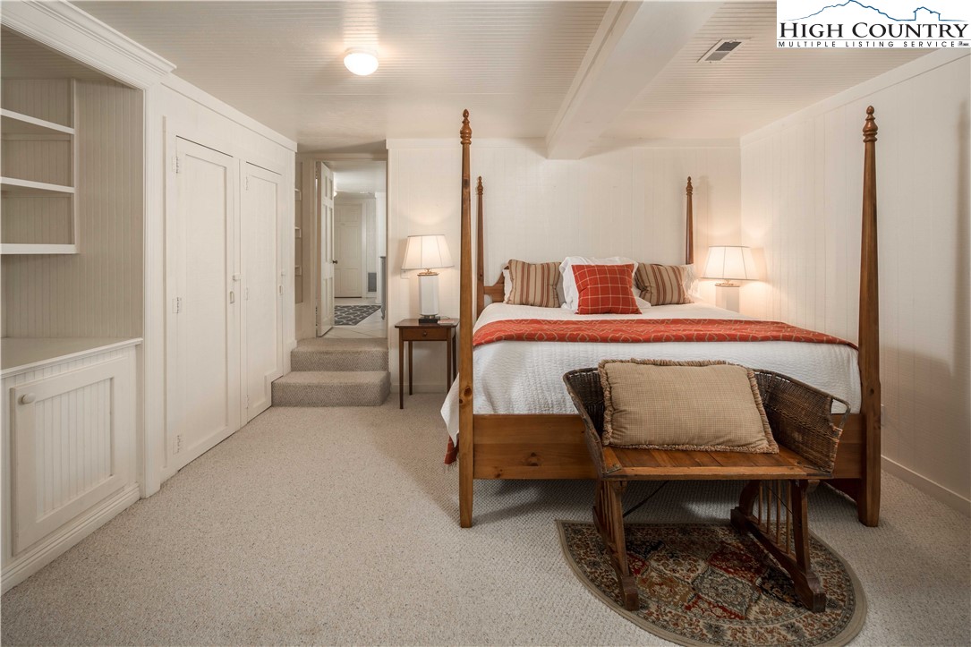 271 Pinnacle Avenue Blowing Rock, NC 28605 - Photo 31 of 43 a bedroom with furniture and a rug