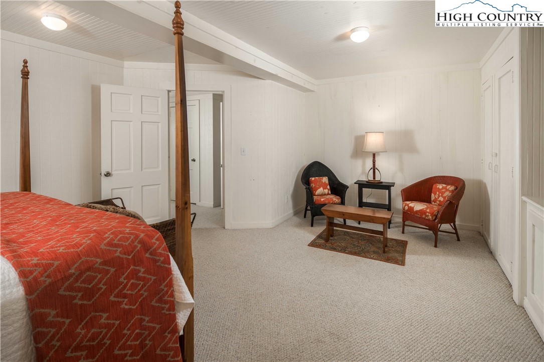 271 Pinnacle Avenue Blowing Rock, NC 28605 - Photo 32 of 43 a bed room with a bed and a chair
