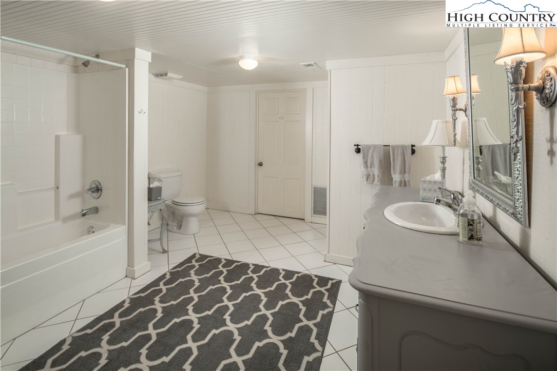 271 Pinnacle Avenue Blowing Rock, NC 28605 - Photo 33 of 43 a bathroom with a sink and a mirror