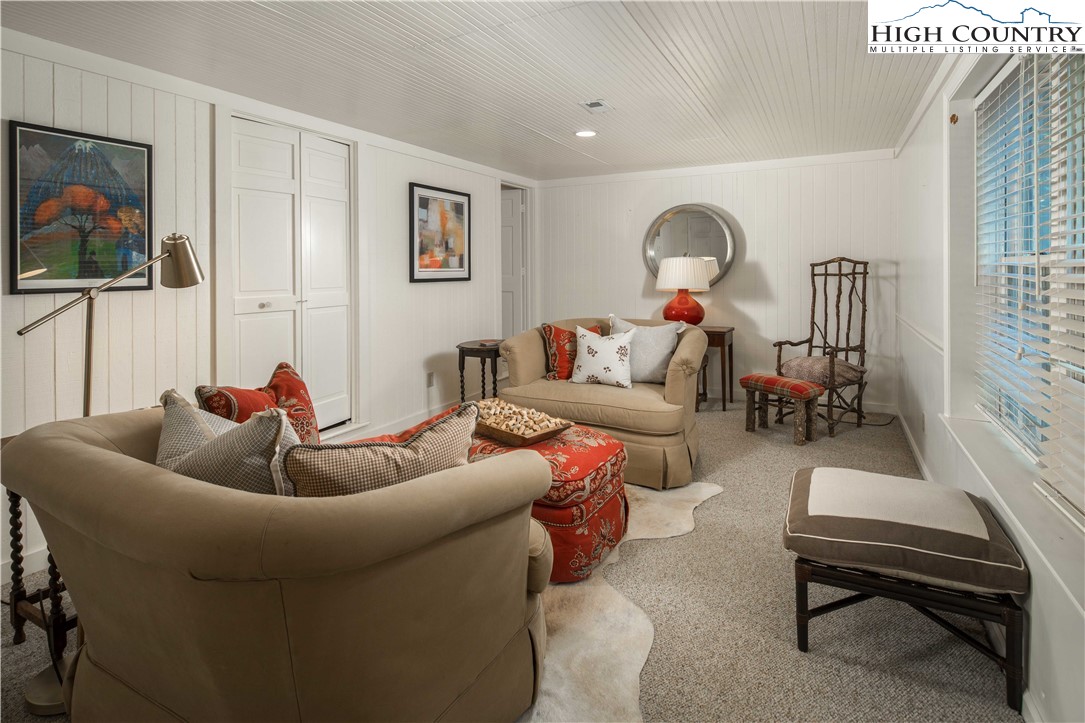 271 Pinnacle Avenue Blowing Rock, NC 28605 - Photo 36 of 43 a living room with furniture and a flat screen tv