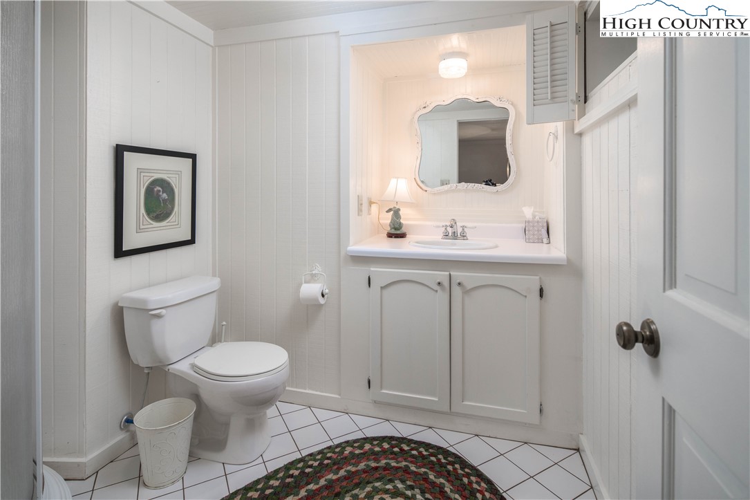 271 Pinnacle Avenue Blowing Rock, NC 28605 - Photo 37 of 43 a bathroom with a toilet sink and mirror