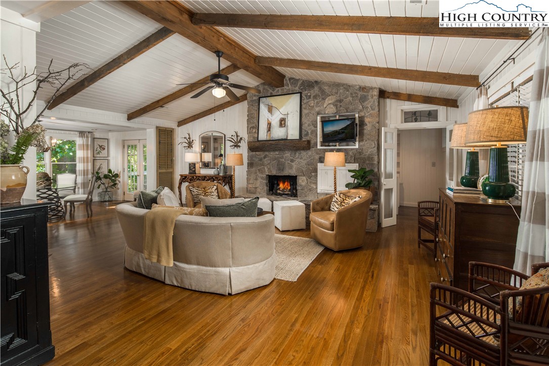 271 Pinnacle Avenue Blowing Rock, NC 28605 - Photo 6 of 43 a living room with fireplace furniture and a wooden floor