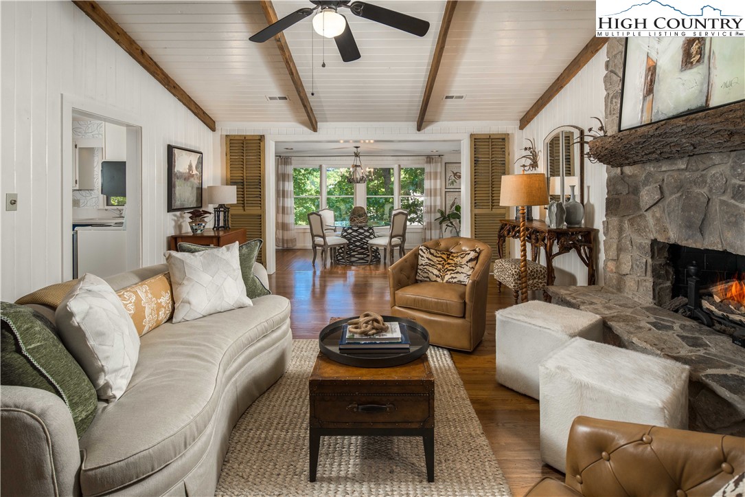 271 Pinnacle Avenue Blowing Rock, NC 28605 - Photo 10 of 43 a living room with furniture a fireplace and a large window