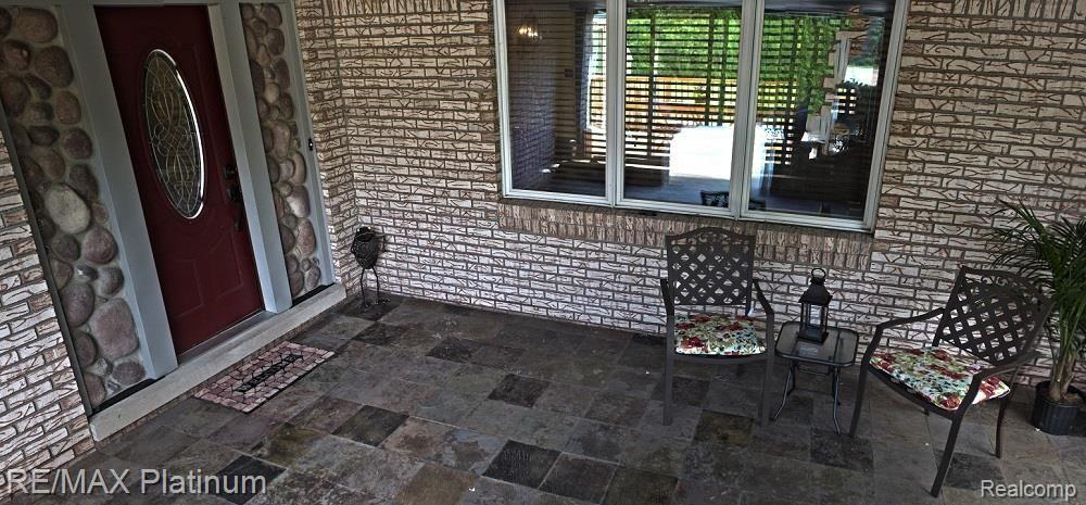 8547 Lake Road Grosse Ile, MI 48138 - Photo 4 of 17 COVERED FRONT PORCH ENTRY WITH SLATE FLOORING
