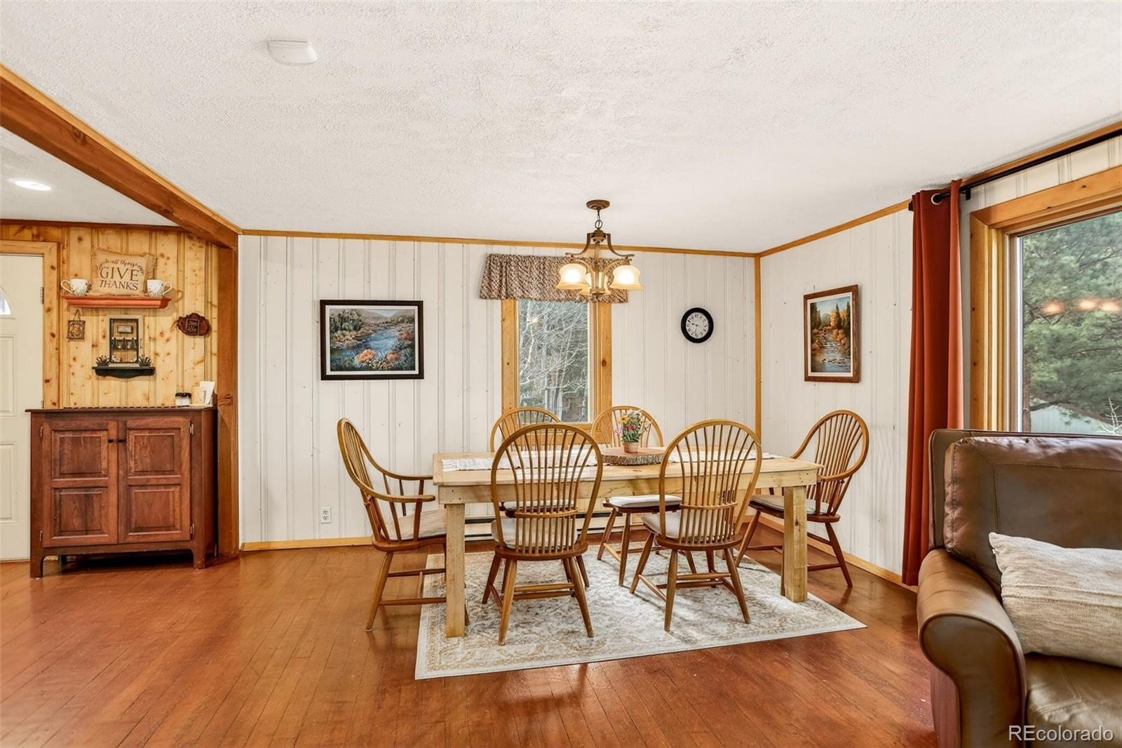 626 Aspen Lane Bailey, CO 80421 - Photo 12 of 47 a view of a dining room with furniture window and wooden floor