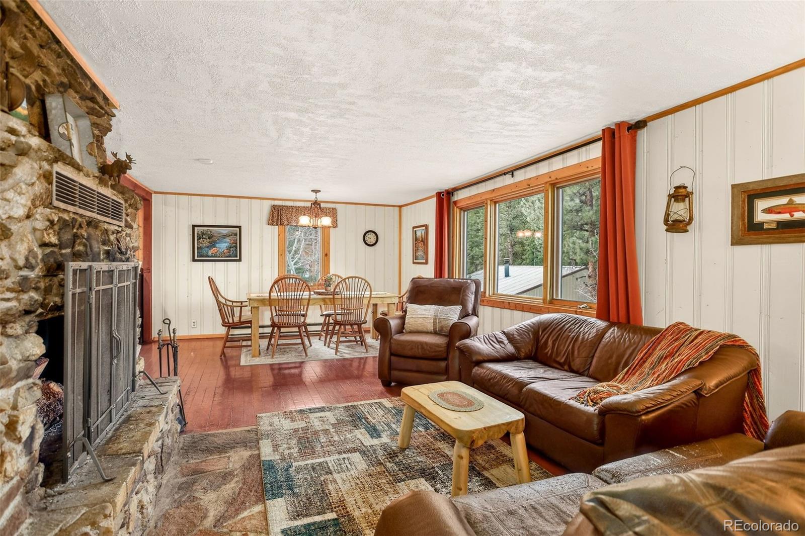 626 Aspen Lane Bailey, CO 80421 - Photo 14 of 47 a living room with furniture and a large window
