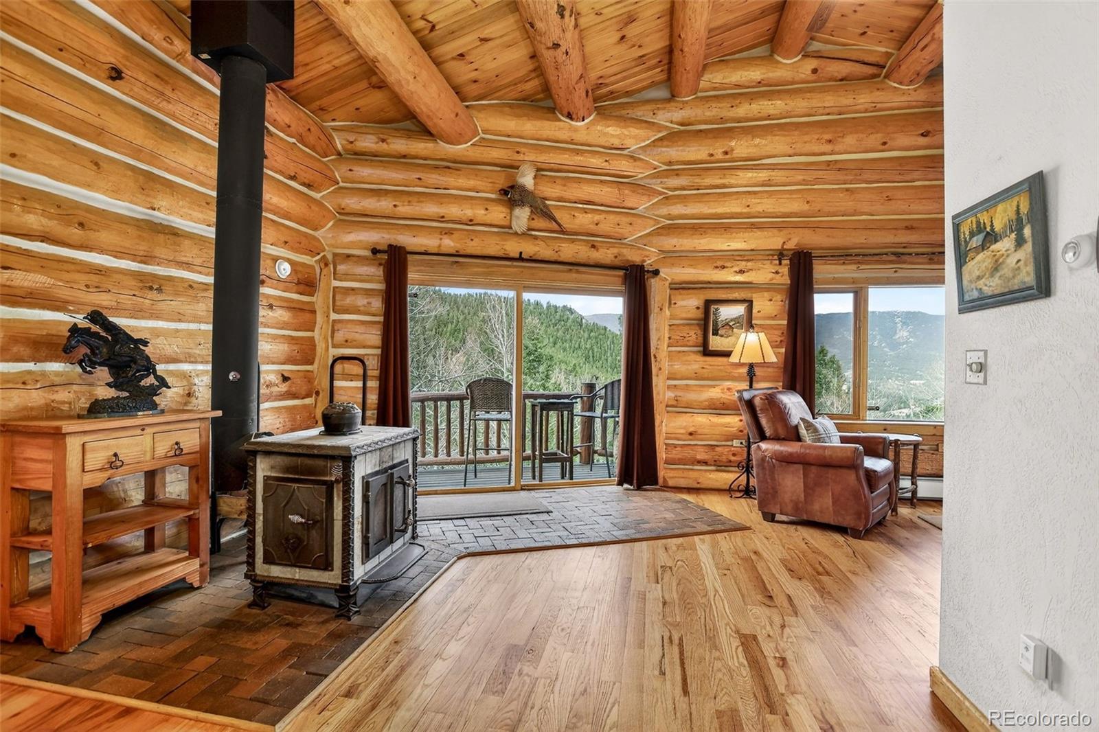 626 Aspen Lane Bailey, CO 80421 - Photo 20 of 47 a view of an entryway with wooden floor