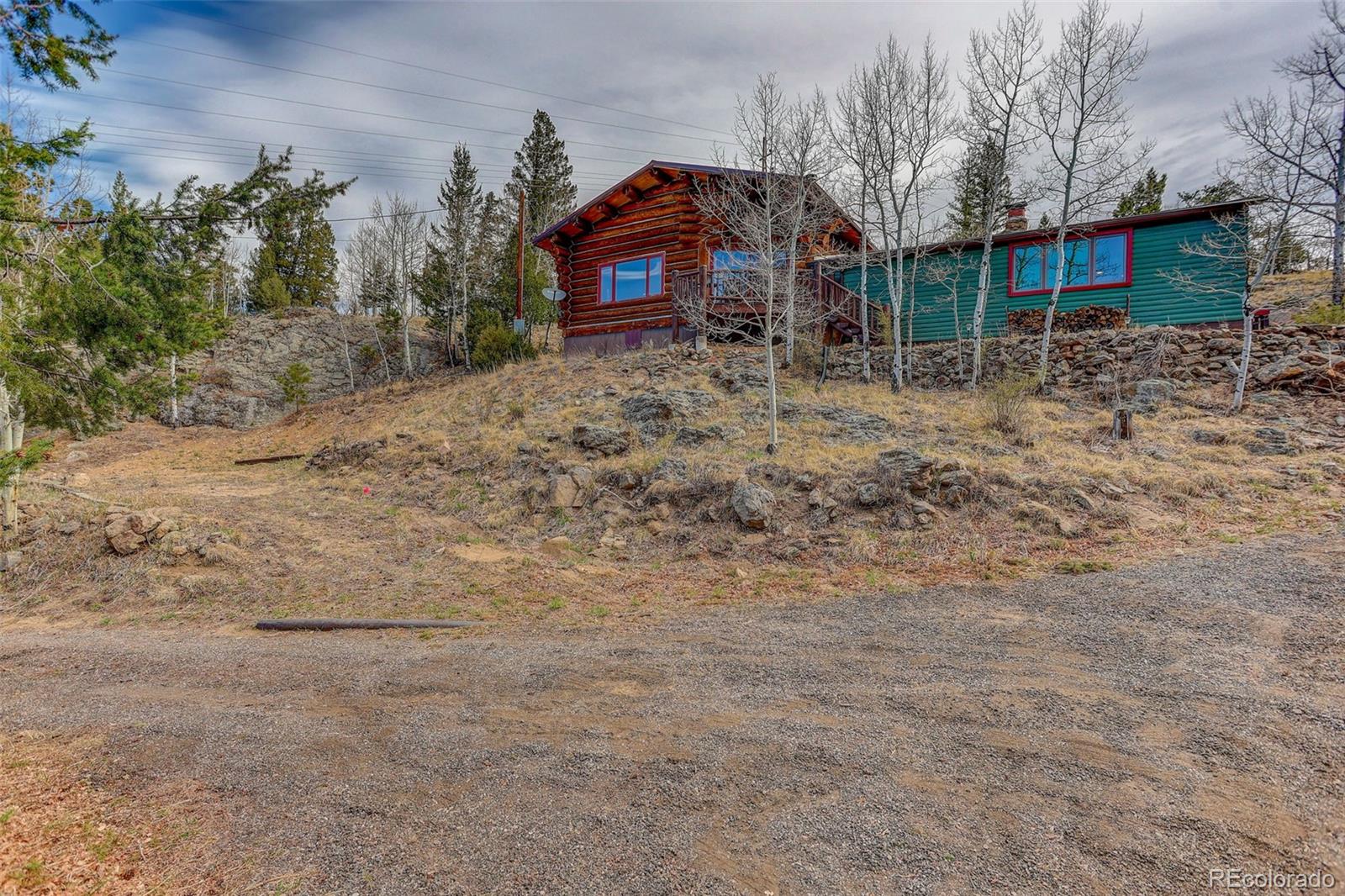 626 Aspen Lane Bailey, CO 80421 - Photo 44 of 47 a front view of a house with trees