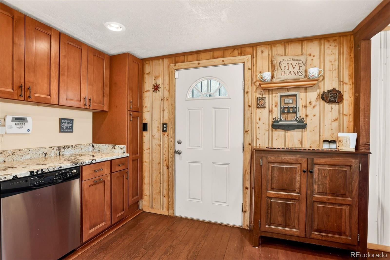 626 Aspen Lane Bailey, CO 80421 - Photo 10 of 47 a bathroom with a granite countertop sink and a mirror