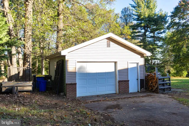 a view of backyard with deck and garden