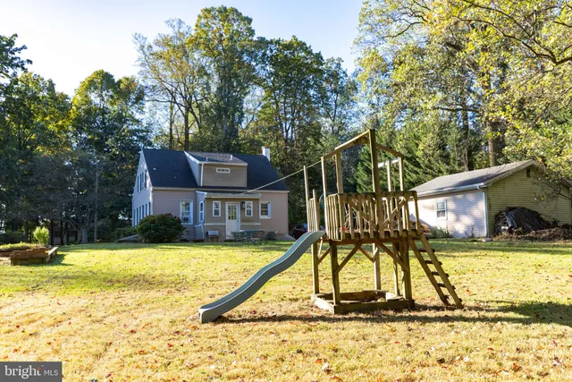 a aerial view of a house with a yard