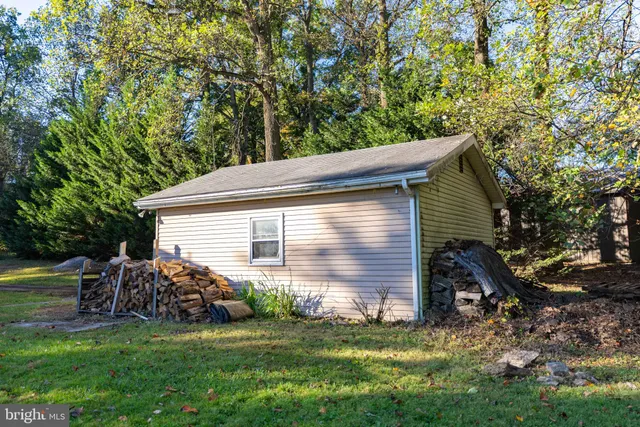 a view of a patio with chairs and table in patio