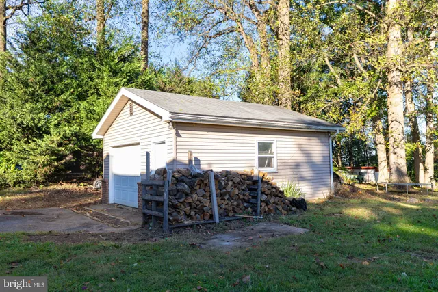 a view of backyard with outdoor seating and green space
