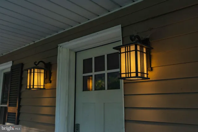 a house view with a sitting space garden and swimming pool