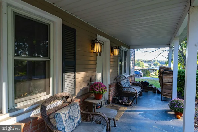 a view of a house with a yard patio and swimming pool