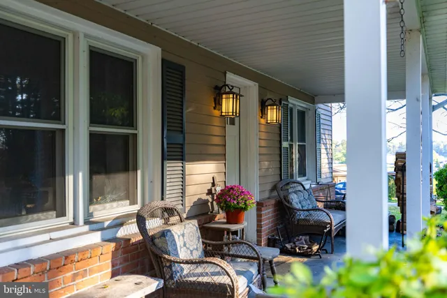 a view of a house with a yard and tree s