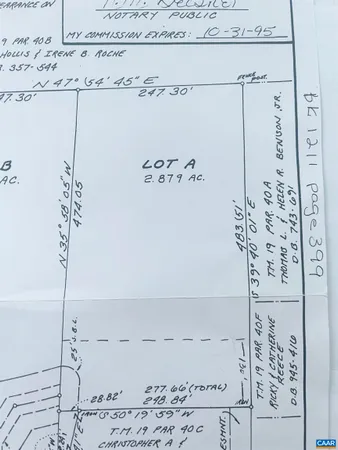 a view of a house with backyard and garden