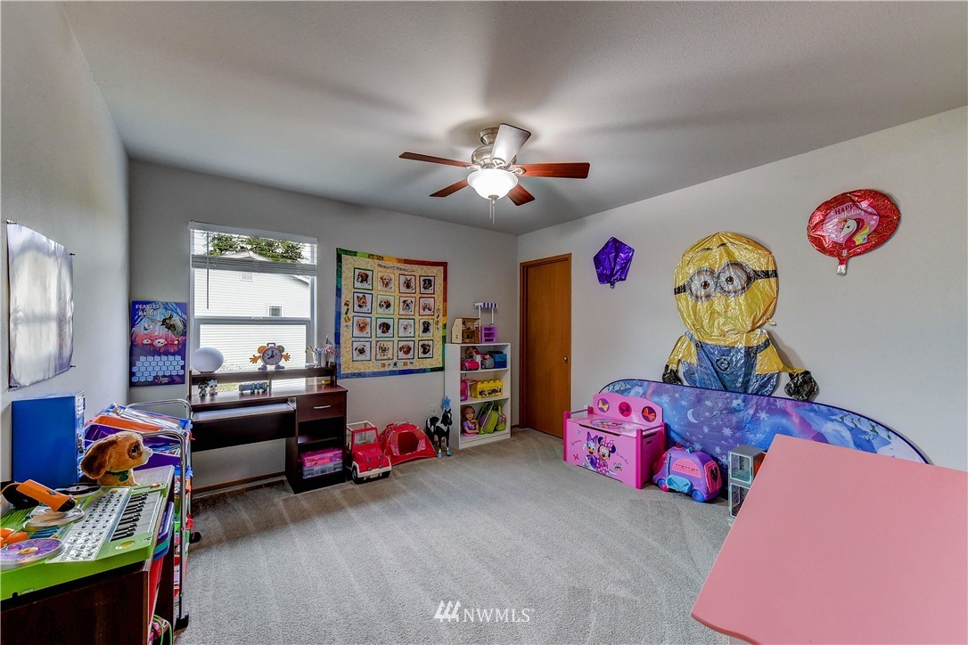 14155 Corbridge Road Southeast Monroe, WA 98272 - Photo 22 of 31 a bedroom with toys and a chandelier