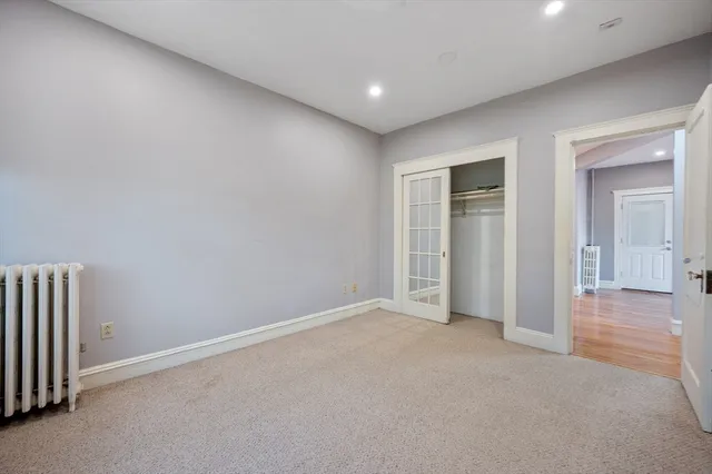an empty room with closet area