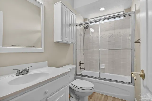 a kitchen with stainless steel appliances kitchen island granite countertop a stove and a refrigerator