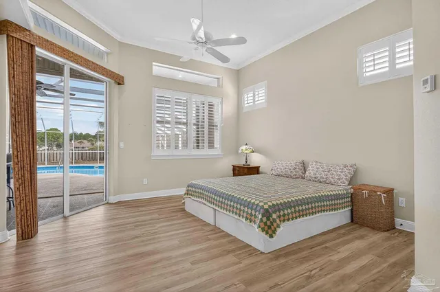 a spacious bathroom with a tub shower and windows
