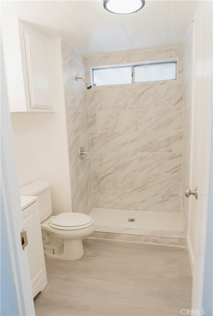 995 Pomona Road, Unit 33 Corona, CA 92882 - Photo 12 of 25 a bathroom with a toilet and a shower