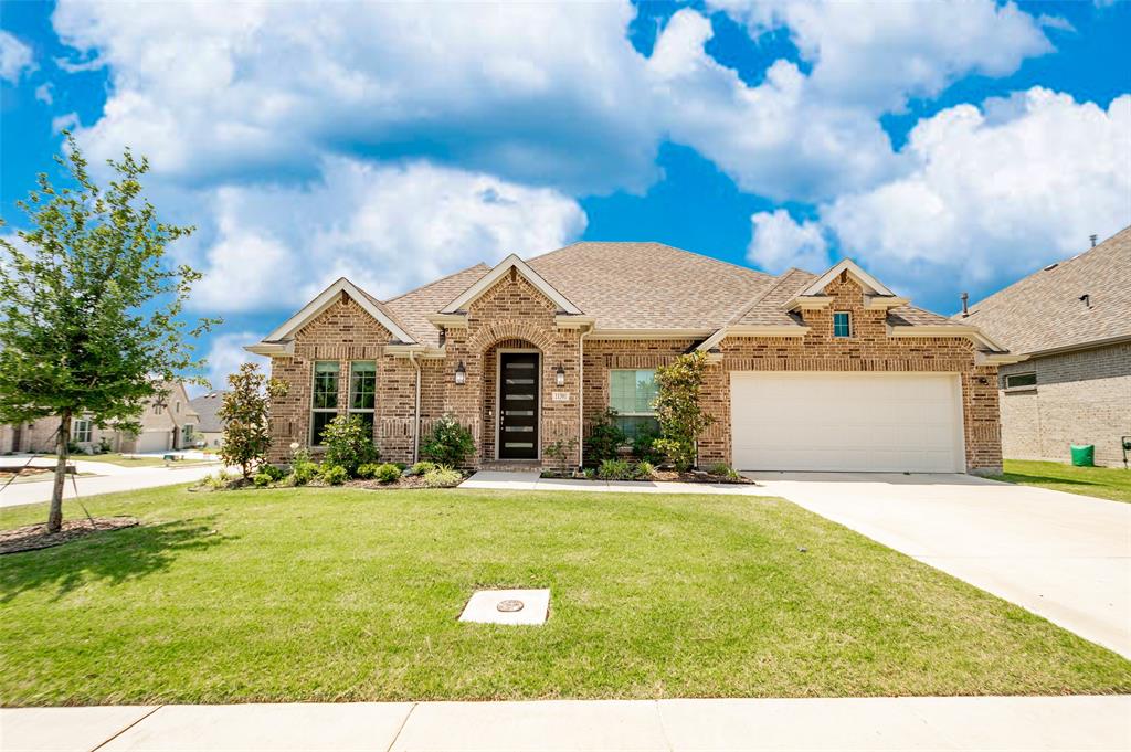 11301 Bull Head Lane Flower Mound, TX 76262 - Photo 1 of 1 a front view of a house with a yard
