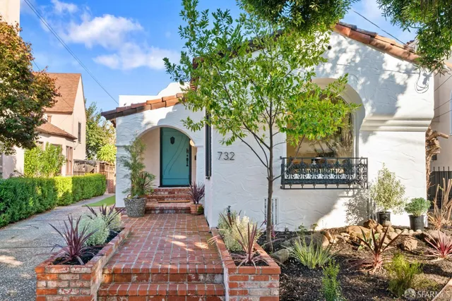 a view of a patio with table and chairs and potted plants