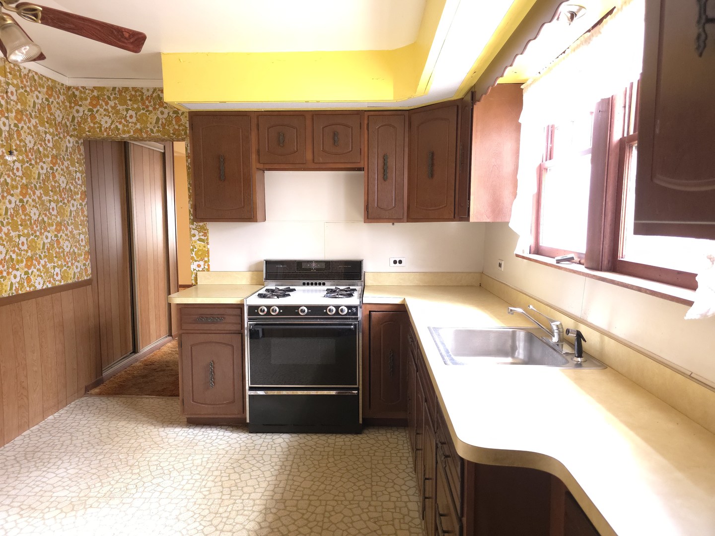 1021 173rd Street Hazel Crest, IL 60429 - Photo 7 of 24 a kitchen with stainless steel appliances granite countertop a sink and a stove