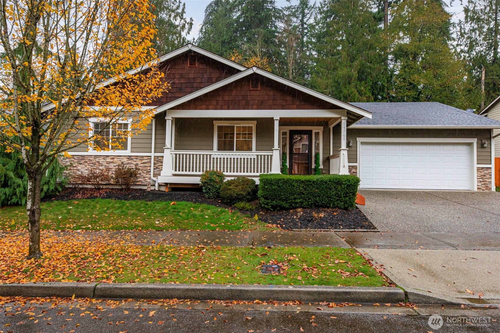 19769 Mountain Ridge Road Southeast Monroe, WA 98272 - Photo 1 of 38 a front view of a house with a yard
