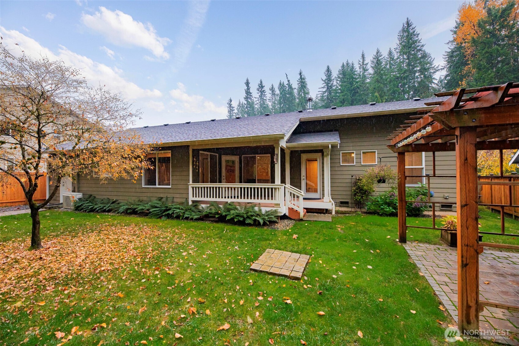 19769 Mountain Ridge Road Southeast Monroe, WA 98272 - Photo 38 of 38 a view of a house with a yard and sitting area
