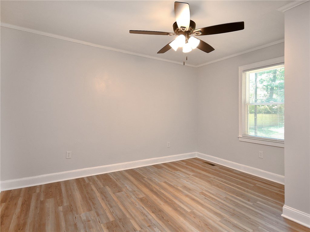 3517 Shawnee Avenue Anderson, SC 29626 - Photo 25 of 25 A quiet bedroom featuring light wood flooring and a window with natural light.
