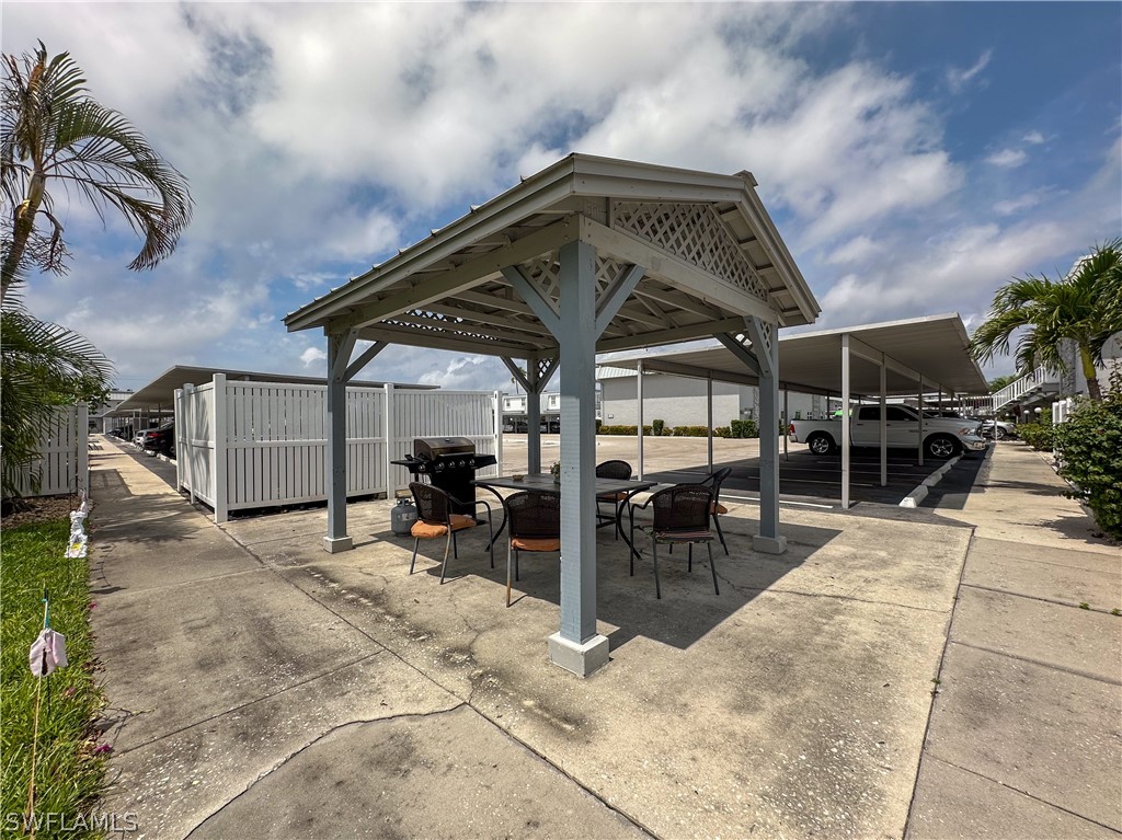 6777 Winkler Road, Unit 168 Fort Myers, FL 33919 - Photo 30 of 37 a view of a chairs and table in patio
