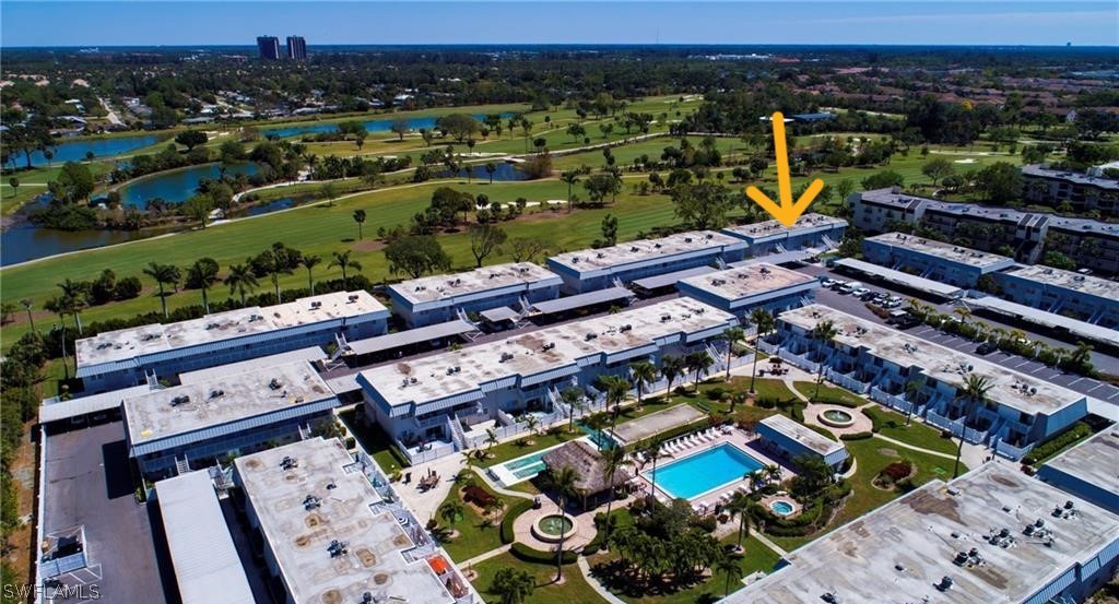 6777 Winkler Road, Unit 168 Fort Myers, FL 33919 - Photo 35 of 37 an aerial view of a houses with a swimming pool
