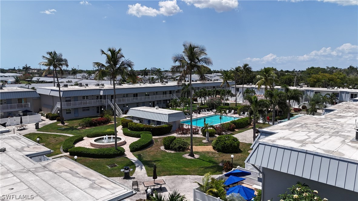 6777 Winkler Road, Unit 168 Fort Myers, FL 33919 - Photo 37 of 37 a view of a patio with table and chairs potted plants