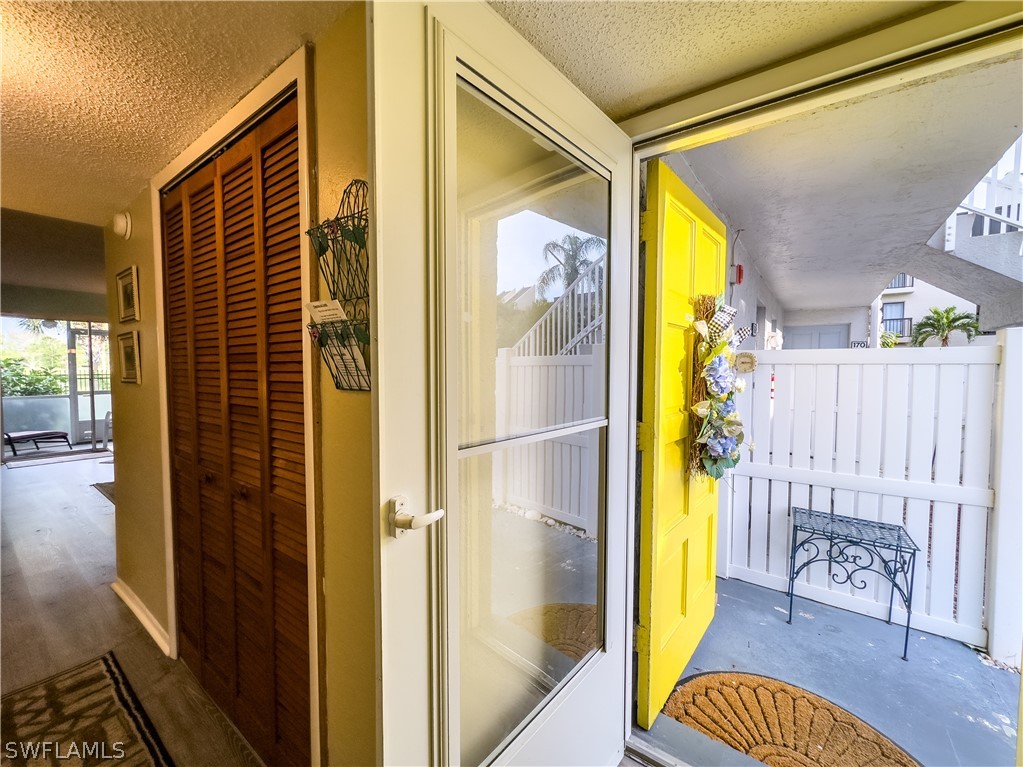 6777 Winkler Road, Unit 168 Fort Myers, FL 33919 - Photo 4 of 37 a view of a porch with a door