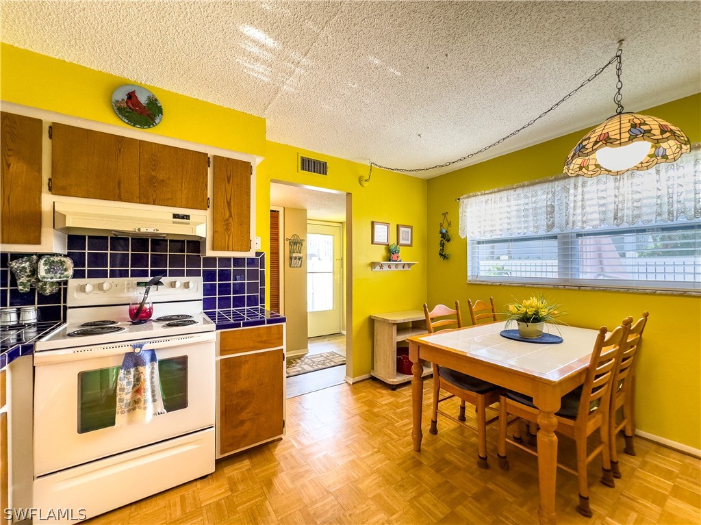 6777 Winkler Road, Unit 168 Fort Myers, FL 33919 - Photo 8 of 37 a view of a dining room with furniture and window