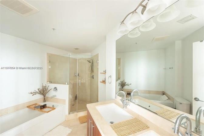 79 Southwest 12th Street, Unit 3601S Miami, FL 33130 - Photo 19 of 27 a bathroom with a granite countertop sink a mirror and a shower