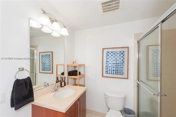 79 Southwest 12th Street, Unit 3601S Miami, FL 33130 - Photo 20 of 27 a bathroom with a sink vanity granite and toilet