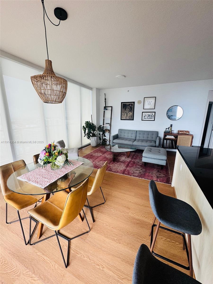 79 Southwest 12th Street, Unit 3601S Miami, FL 33130 - Photo 5 of 27 a living room with furniture and a table