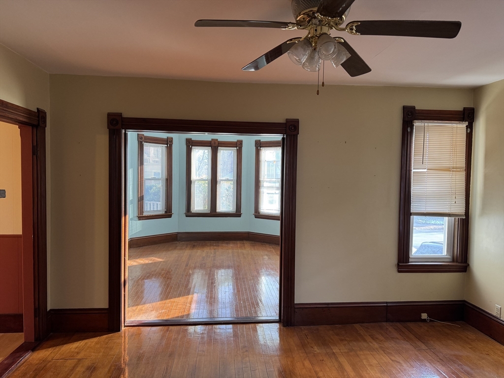 93 Cross Street Gardner, MA 01440 - Photo 11 of 35 a view of a livingroom with a ceiling fan and window