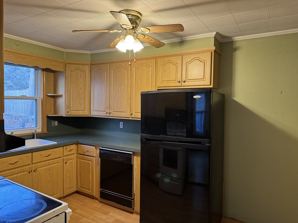 93 Cross Street Gardner, MA 01440 - Photo 21 of 35 a kitchen with a refrigerator and a sink