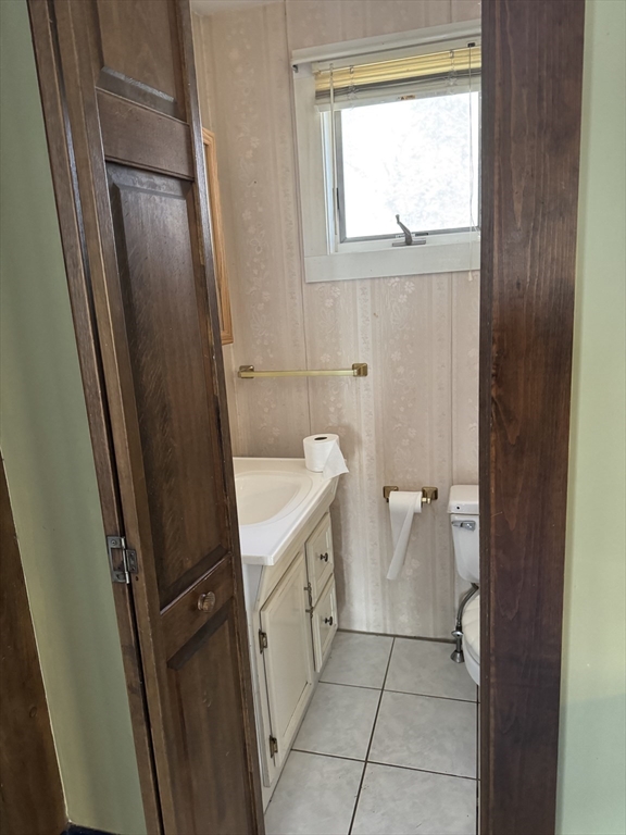 93 Cross Street Gardner, MA 01440 - Photo 23 of 35 a bathroom with a granite countertop sink toilet and shower