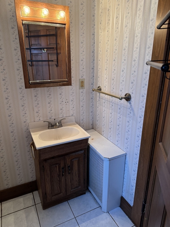 93 Cross Street Gardner, MA 01440 - Photo 30 of 35 a bathroom with a sink and a mirror