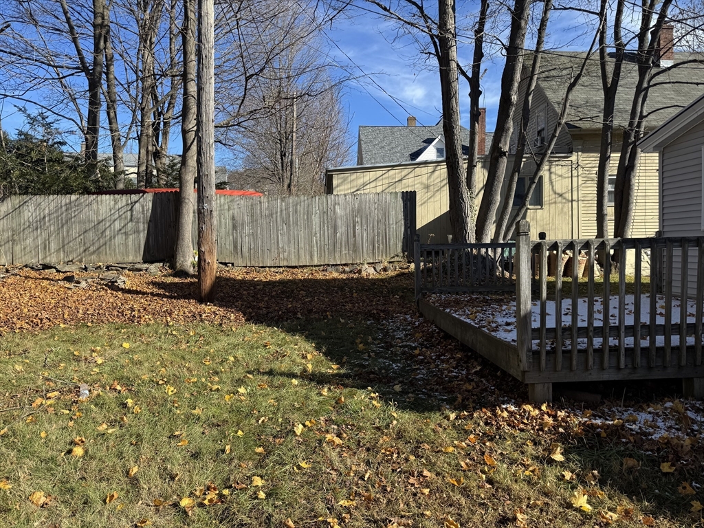 93 Cross Street Gardner, MA 01440 - Photo 34 of 35 a view of a backyard with wooden fence