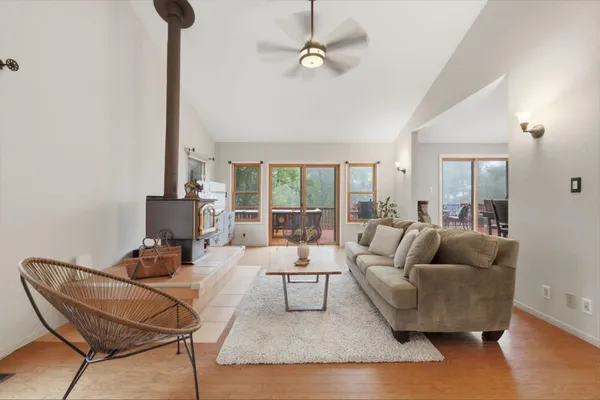 a kitchen with stainless steel appliances kitchen island granite countertop a stove a sink a refrigerator and cabinets